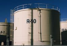 India’s Fuel Supply Remains Stable Despite Regional Challenges: What You Need to Know Large industrial tanks against a clear blue sky.